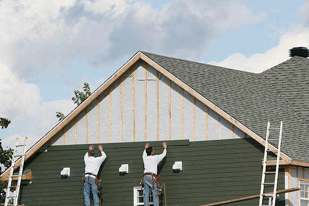Professional Storm Damage Siding Repair technician working in Commack, NY